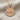 Wave Swimmer Pendant, rose gold, view on fabric