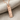 Swim Mantra Pendant, rose gold, angled view on fabric