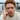 Front view of man with red hair wearing the 14K gold vermeil Bitcoin signet ring on his right hand.