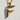Close-up of the handcrafted bird letter F pendant highlighting the intricate avian details and rich gold texture