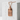 Japan Rising Sun Tag Pendant, rose gold, displayed on white concrete block