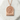 Yokohama Ferris Wheel Pendant, rose plated silver, flat lay on white stone