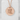 Hammered Do Kanji Pendant, rose gold, display on concrete pedestal
