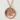 Hikari Kanji Light Pendant, rose gold finish, front view on textured background