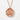 Hammered Truth Kanji Pendant, rose gold, front view on textured background