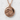 Great Wave Medallion Pendant, rose gold, front view on white texture