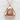Salmon Onigiri Pendant, rose gold, front view on textured surface