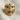 Lobotomy Skull Ring, gold vermeil, front view on textured fabric
