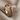 Wood Grain Crucifix Ring, rose gold, angled product photo on fabric