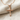 Passion Nail Cross Pendant, rose gold, front view on linen fabric