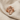 INRI Jesus Cross Ring, rose plated silver, front view on linen