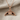 Diving Whale Tail Pendant, rose gold, flat lay view on fabric