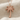 Palm tree pendant, rose gold plated silver, front view on fabric