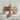 Spread wing eagle ring, rose gold, top view on textured stone