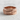 Warrior Spear Ring, rose gold, product photo on textured surface
