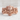 Mayan Mask Ring, rose gold, front view on stone surface