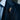 Acacia Sprig Lapel Pin worn on model, pinned to a suit lapel