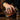 Si Vis Pacem Swords Ring worn on model hand pouring a decanter