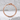 Serpent Ouroboros Band Ring, rose gold plated, front view on textured stone
