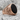 Airborne Onyx Ring, rose gold, angled side view on rock