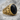 Black Onyx Skull Ring, gold vermeil, product photo on stone