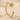 Egyptian Lotus Cuff Earring, gold vermeil, angled view on sand