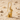 Bastet Cat Earring, gold vermeil, sitting on sand