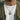 Male model wearing a two-tone oxidized silver Kintsugi medallion pendant over a casual white t-shirt