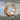Cracked Rock Brutalist Hoop Earring, gold vermeil, product photo on stone