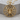 Spiderweb Medallion Pendant, gold vermeil, front view on wood block