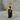 Molten Black Tourmaline Pendant, gold vermeil, product photo on stone display