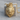 Crowned Royal Lion Pendant, gold vermeil, front product view on wood