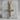 Three Nails Cross Pendant, gold vermeil, front view on concrete block