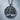 Tree of Life Circle Pendant, oxidized, front view on stone pedestal
