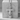 Palmette Orthodox Cross Pendant, polished, front view on stone pedestal