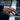 Embracing Hands Hug Ring, gold vermeil, worn on model hand at piano