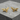 Flying Eagle Cufflink, gold vermeil, angled product photo on stone