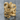 Coiled Serpent Ring, gold vermeil, front view on stone surface