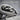 Coiled Snake Skull Ring, angled close-up view of skull and serpent scales