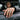 Man wearing an onyx dragon signet ring on his middle finger resting on an open car window in lifestyle photo