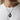 Men's neck wearing handcrafted oxidized silver raven cameo necklace with white t-shirt for daily style
