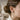 Side view of model wearing oxidized silver skeleton hand earring wrapping around earlobe for an illusion grip