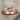 Infinity Knot Loop Ring, rose plated silver, front view on linen