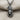 Eagle Wolf Totem Pendant, oxidized silver, front view on textured fabric