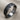 Hexagonal moon crater ring, oxidized silver, angled product photo on fabric