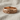 Celtic Braided Knot Ring, rose gold, front view on linen