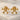 Bone Flower Earring, gold vermeil, pair displayed on stone surface