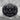 Japanese Oni Demon Ring, black rhodium, front view on stone pedestal