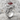 Double Ram Ring, polished silver, angled three-quarter view