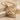 Skeleton leaf moth pendant, gold vermeil, product photo on stone
